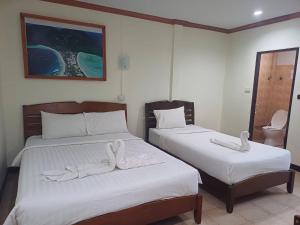 Tempat tidur dalam kamar di Golden Bee PhiPhi