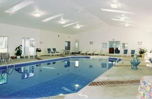 a large swimming pool in a large room at Exit 5 Resort & Condominium in Saco