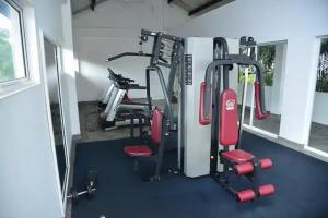 a gym with two tread machines in a room at Cozy 2 bed 1 bath Apartment for rent in Homagama