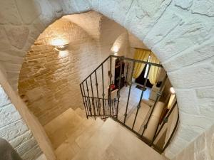 an overhead view of a staircase in a stone building at Trulli Contento - Rooms & Apartments in Alberobello
