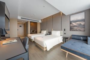 Ліжко або ліжка в номері Atour Hotel Hefei USTC Huangshan Road