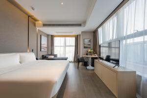 Ліжко або ліжка в номері Atour Hotel Hefei USTC Huangshan Road