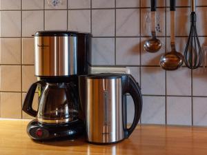 a coffee pot sitting on top of a counter at Comfortable house with garden in Voralberg in Sankt Gallenkirch