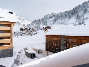 a view from the roof of a building in the snow at Wohnung in Schröcken bei Ski Arlberg in Schröcken