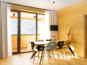 a dining room with a table and chairs at My Heimat 1495 Arlberg in Schröcken