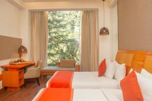 Voodi või voodid majutusasutuse Yog Wellness Resort & Spa By Amritara toas
