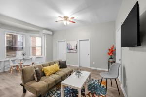 a living room with a couch and a table at Lovely 2br In Univ City in Philadelphia
