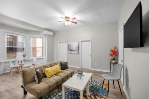 a living room with a couch and a table at Univ City Drexel 2 Bdrm Lovely Unit in Philadelphia