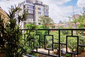 a balcony with a view of a building at The happy place - Westlands, Nairobi in Nairobi