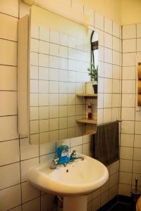 a bathroom with a sink and a mirror at The happy place - Westlands, Nairobi in Nairobi