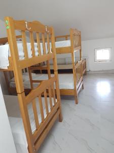 two bunk beds in a room with a tile floor at Villa House Georgia in Tbilisi City