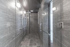 a bathroom with a shower and a walk in shower at Villa Yin Niseko in Kutchan +13 photos
