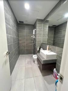 a bathroom with a sink and a toilet at 2Bed For 4 // KLIA Sepang Xiamen University in Sepang
