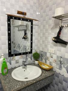a bathroom with a sink and a mirror at Center Tam Coc Homestay in Ninh Binh