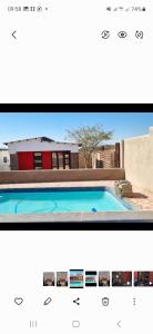 a screenshot of a website with a picture of a swimming pool at Vegas Guesthouse in Bushbuckridge