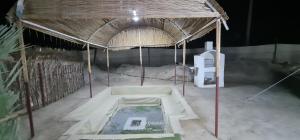 an inside view of a building with a tent at Al Fannan Farm - Camping Area in Ras al Khaimah