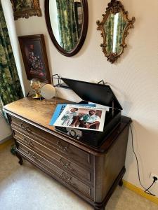 a wooden dresser with a box on top of it at Bastide du Soldat in Abreschviller