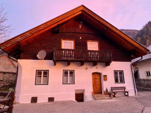 a house with a balcony on top of it at Apartment Ad Alta Obervellach in Obervellach
