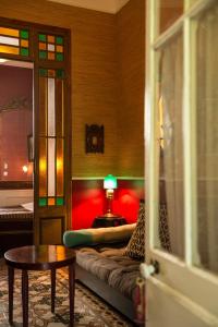 a living room with a couch and a table at La Petite Calanque in Marseille