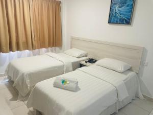 Postel nebo postele na pokoji v ubytování De Ocean Hotel