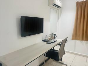 TV a/nebo společenská místnost v ubytování De Ocean Hotel