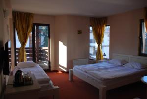 Postel nebo postele na pokoji v ubytování Guest House ANEX