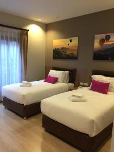 Postel nebo postele na pokoji v ubytování Ben Guesthouse
