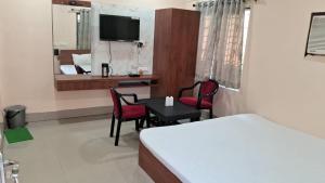A bed or beds in a room at NEW MOUCHAK HOTEL & RESORTS