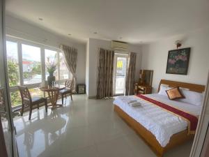 Postel nebo postele na pokoji v ubytování Đức Anh HoTel Vũng Tàu