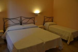 Postel nebo postele na pokoji v ubytování B&B La Pavoncella