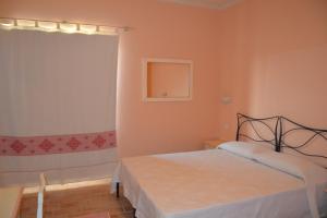 Postel nebo postele na pokoji v ubytování B&B La Pavoncella