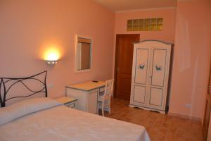 Postel nebo postele na pokoji v ubytování B&B La Pavoncella
