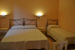 Postel nebo postele na pokoji v ubytování B&B La Pavoncella