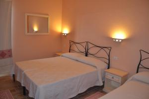 Postel nebo postele na pokoji v ubytování B&B La Pavoncella