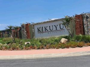 a sign for a kikuyu theater on the side of a road at URlyfstyle Cottage @ Kikuyu waterfall in Midrand