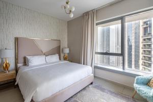 Ένα ή περισσότερα κρεβάτια σε δωμάτιο στο Bellavista - Glamorous - 2BR - 29 Boulevard - Burj Khalifa & Fountain View +53 φωτογραφίες