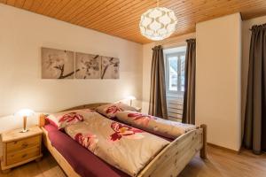Postel nebo postele na pokoji v ubytování Chasa Silvretta