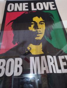 a poster for the one love bob marley movie at Bob Marley Peace hostels luxor in Luxor