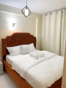 Кровать или кровати в номере NLS