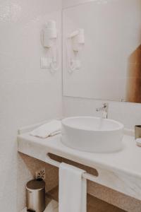 Um banheiro em Apartamentos Sol & Ria
