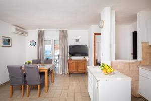 TV a/nebo společenská místnost v ubytování Vista Blue Apartments