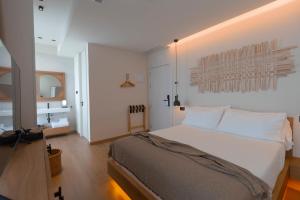 Posteľ alebo postele v izbe v ubytovaní Malates Slow Boutique Hotel + 37 fotografií