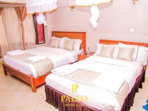 Postel nebo postele na pokoji v ubytování Paleo Hotel and Spa, Thika