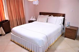 Postel nebo postele na pokoji v ubytování Paleo Hotel and Spa, Thika