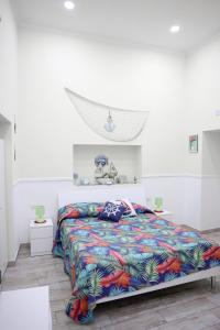 Ένα ή περισσότερα κρεβάτια σε δωμάτιο στο Concept b&b naples