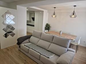 a living room with a couch and a table at Casa BE&LA in Soto en Cameros
