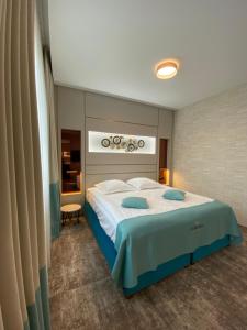 Postel nebo postele na pokoji v ubytování Hotel Coroana