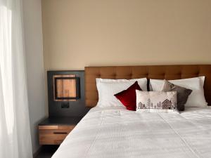 Postel nebo postele na pokoji v ubytování Hotel Rododendro Val di Fassa