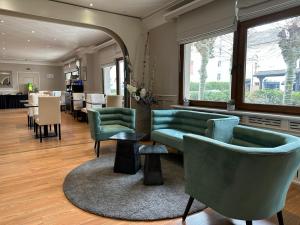 Posezení v ubytování Hotel Le Divona "au coeur de Divonne"