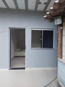 a room with a bed inside of a wall at Rancho do allan in Três Marias